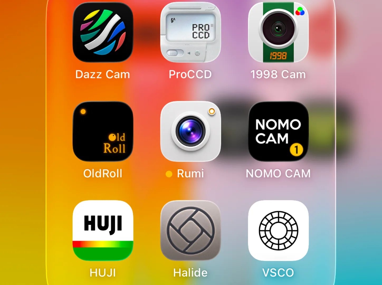 Phone home screen showing camera apps including Dazz Cam, ProCCD, 1998 Cam, OldRoll, Rumi, NOMO CAM, HUJI, Halide and VSCO